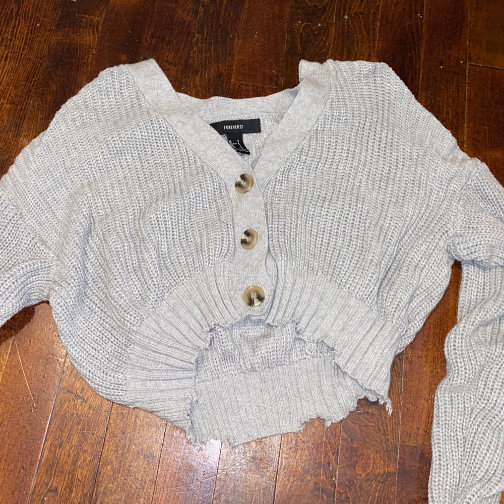 A cropped cardigan sweater